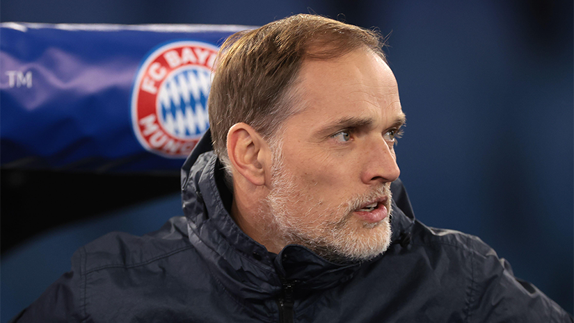 A man with short hair and facial hair wears a dark jacket, seated with a Bayern Munich logo visible behind him. The background is blurred, hinting at the vibrant world of Betway Arabia.