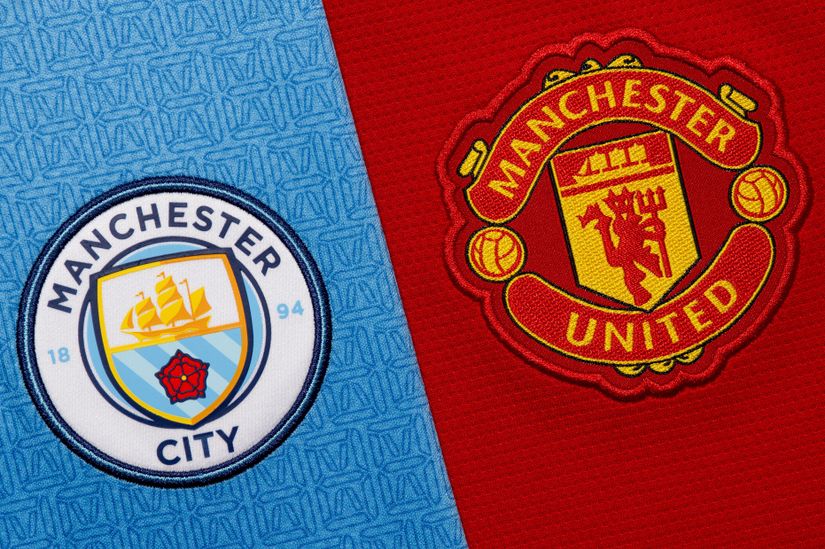 Logos of Manchester City on a blue background and Manchester United on a red background, positioned side by side.