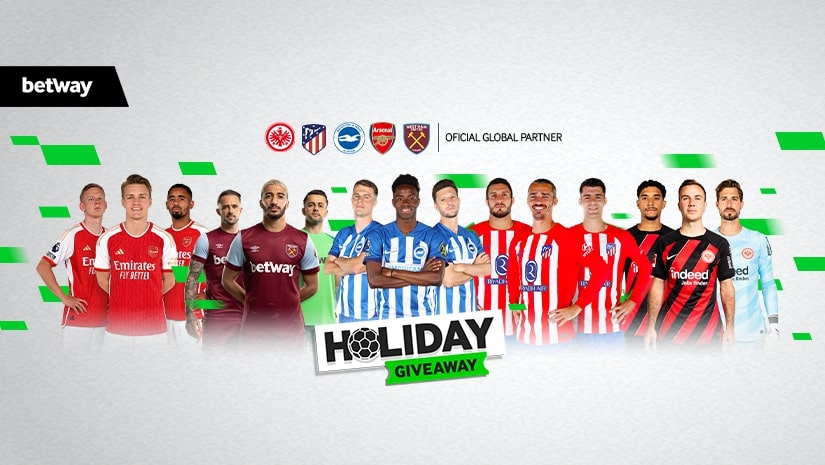 A group of soccer players from various teams stand together, showcasing jerseys from clubs like Arsenal and West Ham. Team logos hover above them. Text reads Holiday Giveaway with the Betway Arabia logo prominently featured in the corner.